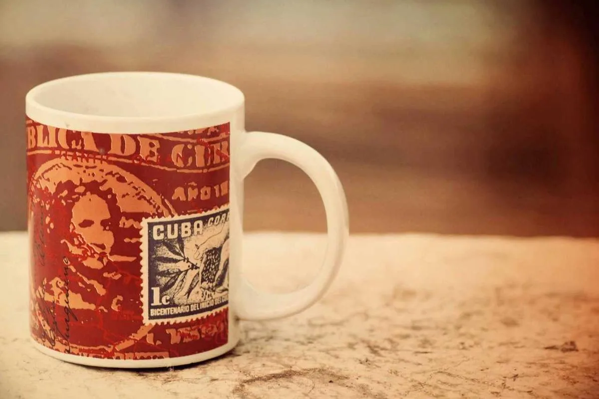 A red patterned coffee mug on a table